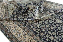 Surface texture of 2000s Nain rug with natural Wool and intricate pattern