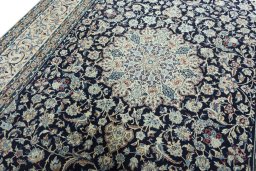 Backside of handmade 2000s Nain rug showing knot structure and weave density