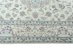 Corner detail of 2000s Nain rug showing border pattern and Wool pile