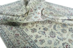 Surface texture of 2000s Nain rug with natural Wool and intricate pattern