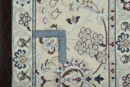 Backside of handmade 2000s Nain rug showing knot structure and weave density