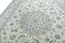 Backside of handmade 2000s Nain rug showing knot structure and weave density
