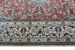 Corner detail of 2000s Nain rug showing border pattern and Wool pile
