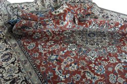 Surface texture of 2000s Nain rug with natural Wool and intricate pattern