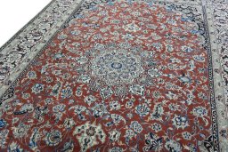 Backside of handmade 2000s Nain rug showing knot structure and weave density
