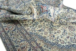 Surface texture of 2000s Nain rug with natural Wool and intricate pattern