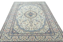 Surface texture of 2000s Nain rug with natural Wool and intricate pattern