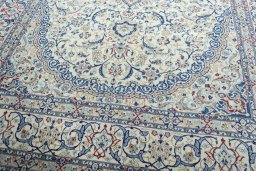Close-up detail of 2000s Nain rug from Iran / Persia showing Wool weave
