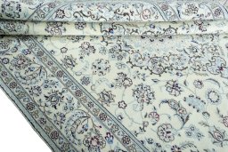 Close-up detail of 2000s Nain rug from Iran / Persia showing Wool weave
