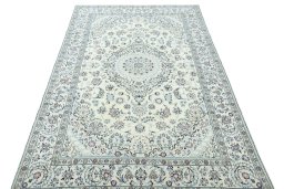 Surface texture of 2000s Nain rug with natural Wool and intricate pattern