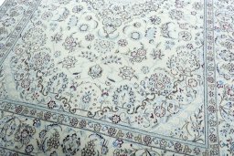Close-up detail of 2000s Nain rug from Iran / Persia showing Wool weave
