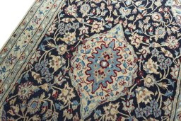 Backside of handmade 2000s Nain rug showing knot structure and weave density