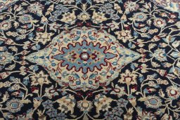 Central medallion detail of 2000s Nain rug from Iran / Persia