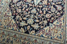 Close-up detail of 2000s Nain rug from Iran / Persia showing Wool weave