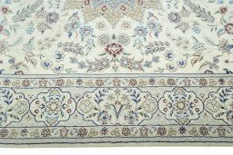 Corner detail of 2000s Nain rug showing border pattern and Wool pile