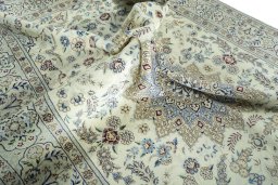 Surface texture of 2000s Nain rug with natural Wool and intricate pattern