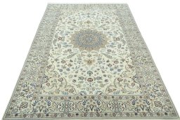 Surface texture of 2000s Nain rug with natural Wool and intricate pattern