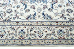 Corner detail of New Nain rug showing border pattern and Wool pile
