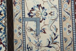 Backside of handmade New Nain rug showing knot structure and weave density