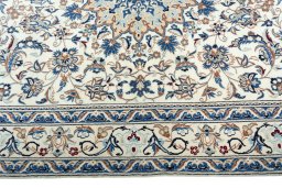 Corner detail of 2000s Nain rug showing border pattern and Wool pile