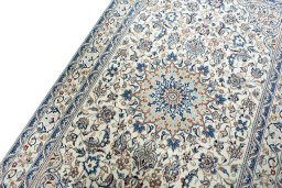 Backside of handmade 2000s Nain rug showing knot structure and weave density