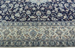 Corner detail of 2000s Nain rug showing border pattern and Wool pile