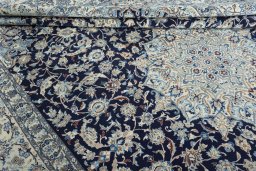 Close-up detail of 2000s Nain rug from Iran / Persia showing Wool weave