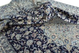 Surface texture of 2000s Nain rug with natural Wool and intricate pattern