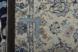 Backside of handmade 2000s Nain rug showing knot structure and weave density