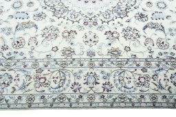 Corner detail of 2000s Nain rug showing border pattern and Wool pile