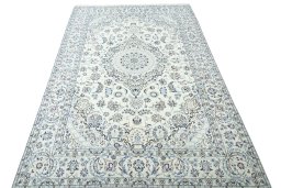Surface texture of 2000s Nain rug with natural Wool and intricate pattern
