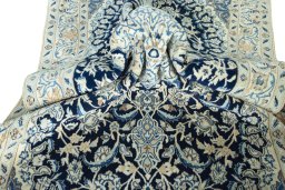 Close-up detail of 2000s Nain rug from Iran / Persia showing Wool weave