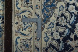 Surface texture of 2000s Nain rug with natural Wool and intricate pattern