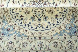 Corner detail of 2000s Nain rug showing border pattern and Wool pile