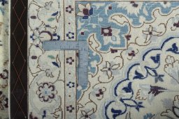 Surface texture of 2000s Nain rug with natural Wool and intricate pattern