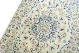 Backside of handmade 2000s Nain rug showing knot structure and weave density