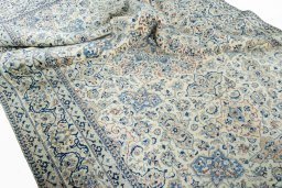 Corner detail of 1970s Nain rug showing border pattern and Cork pile