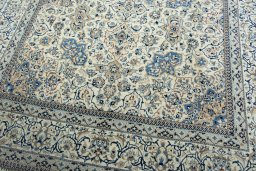 Backside of handmade 1970s Nain rug showing knot structure and weave density