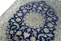 Backside of handmade New Nain rug showing knot structure and weave density