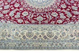 Corner detail of 2000s Nain rug showing border pattern and Wool pile