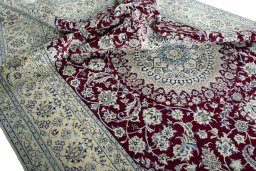 Surface texture of 2000s Nain rug with natural Wool and intricate pattern