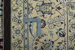 Backside of handmade 2000s Nain rug showing knot structure and weave density