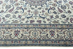 Corner detail of New Nain rug showing border pattern and Wool pile