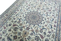 Backside of handmade New Nain rug showing knot structure and weave density