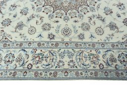 Corner detail of 2000s Nain rug showing border pattern and Wool pile