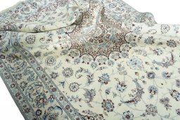 Surface texture of 2000s Nain rug with natural Wool and intricate pattern