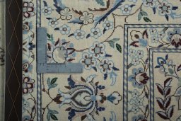 Backside of handmade 2000s Nain rug showing knot structure and weave density