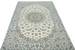 Surface texture of 2000s Nain rug with natural Wool and intricate pattern