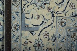 Backside of handmade 2000s Nain rug showing knot structure and weave density