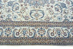 Corner detail of New Nain rug showing border pattern and Wool pile